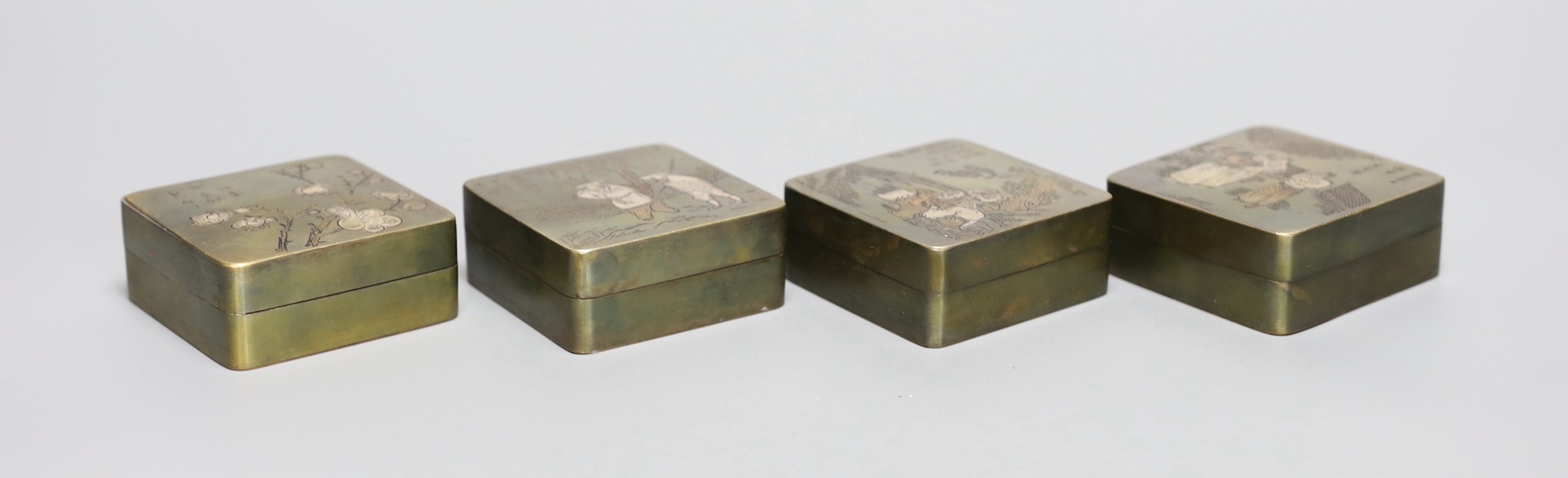 Four Chinese inscribed bronze ink boxes, 7cm sq